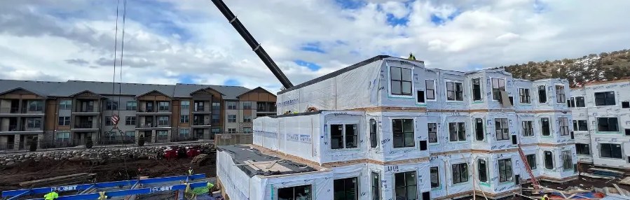 Three-story modular apartment buildings during set