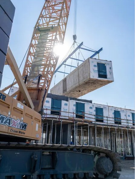 Crawler crane lifting a module into place